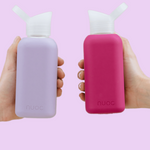 Eco glass bottles 800ml with lavender and raspberry silicone sleeves, premium reusable swag for conferences, giveaways and corporate gifts