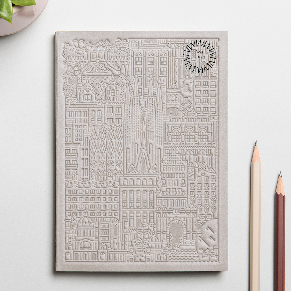 Debossed Barcelona notebook in grey. Branded sustainable notebook from women-owned brands.