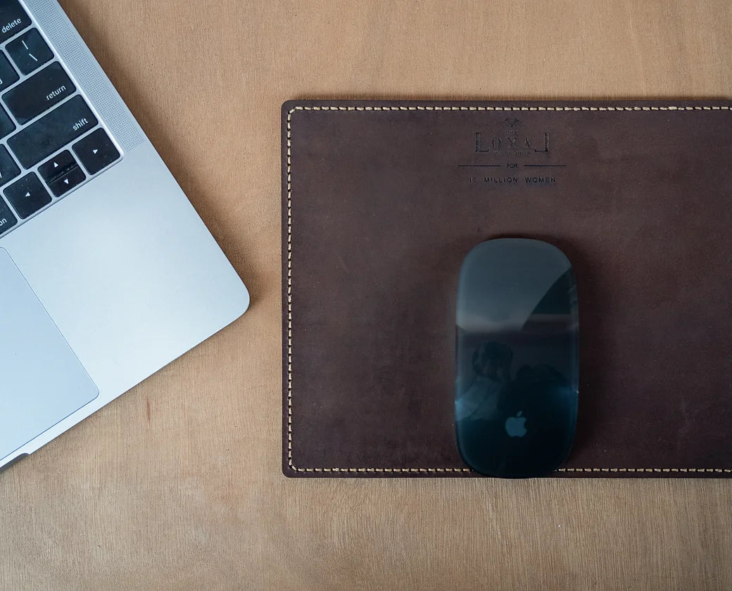 Hand stitched leather mouse pad, artisan made with vegetable-tanned leather. Sustainable corporate gift from women-owned brands.