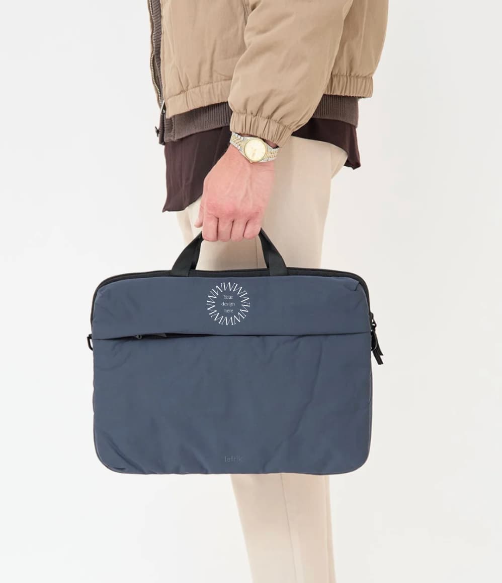 Blue recycled laptop briefcase personalised with company logo being carried by hand