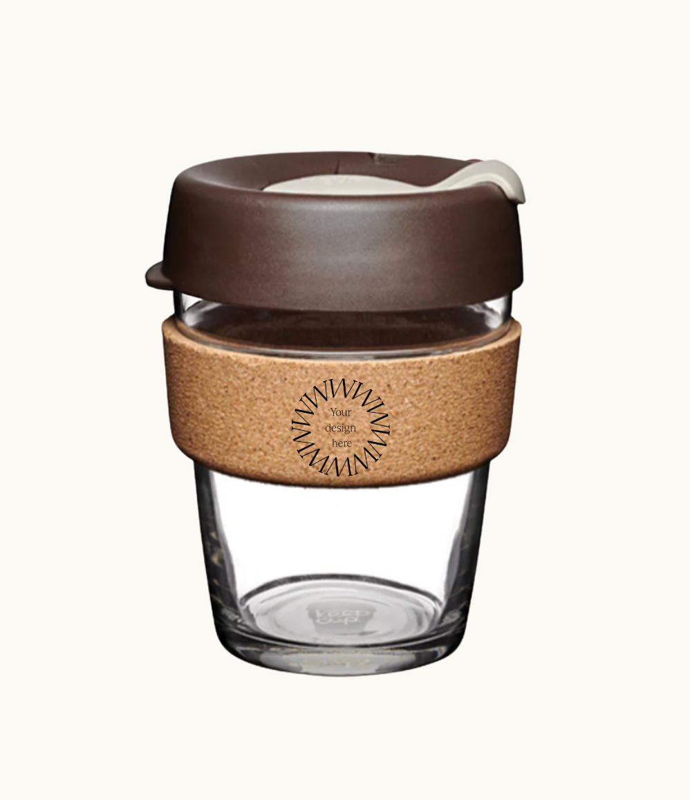 12oz reusable glass cup with natural cork band and brown lid. Sustainable corporate gifts