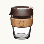 12oz reusable glass cup with natural cork band and brown lid. Sustainable corporate gifts