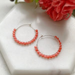 Coral beaded hoop earrings. Sustainable corporate gifts