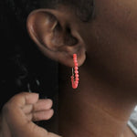 Coral beaded hoop earrings