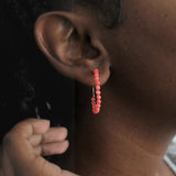 Coral beaded hoop earrings