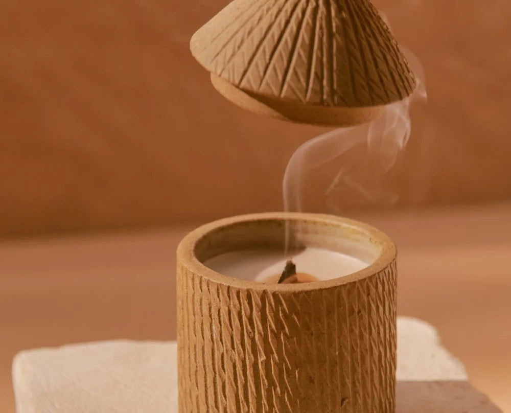 Artisan made candle with hut lid. Sustainable women-owned corporate gift.