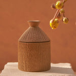 Handcrafted African artisan hut candle, sustainable corporate gifts for women 