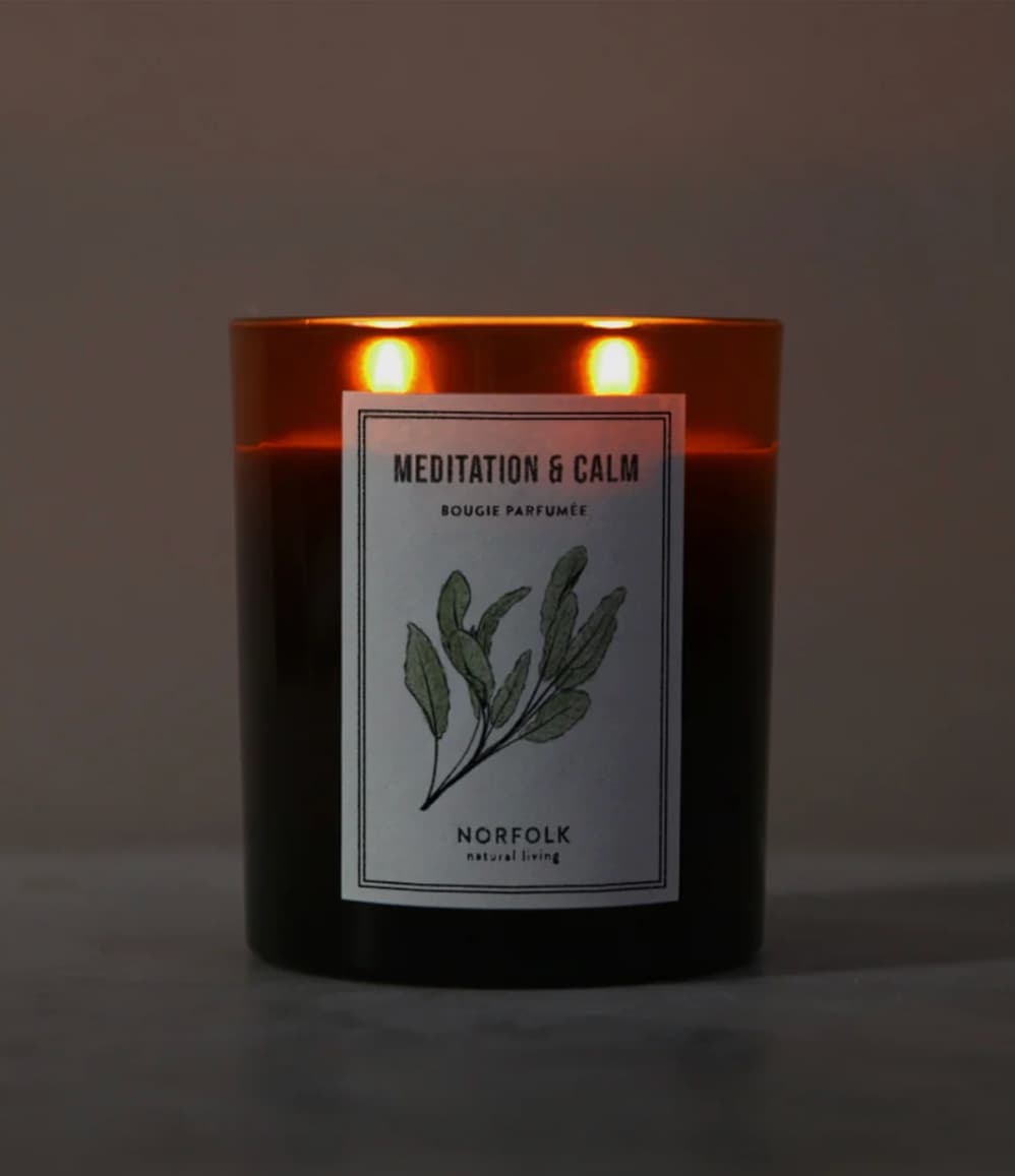 Meditation and Calm aromatherapy candle by Norfolk Natural Living lit with two wicks
