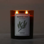 Meditation and Calm aromatherapy candle by Norfolk Natural Living lit with two wicks