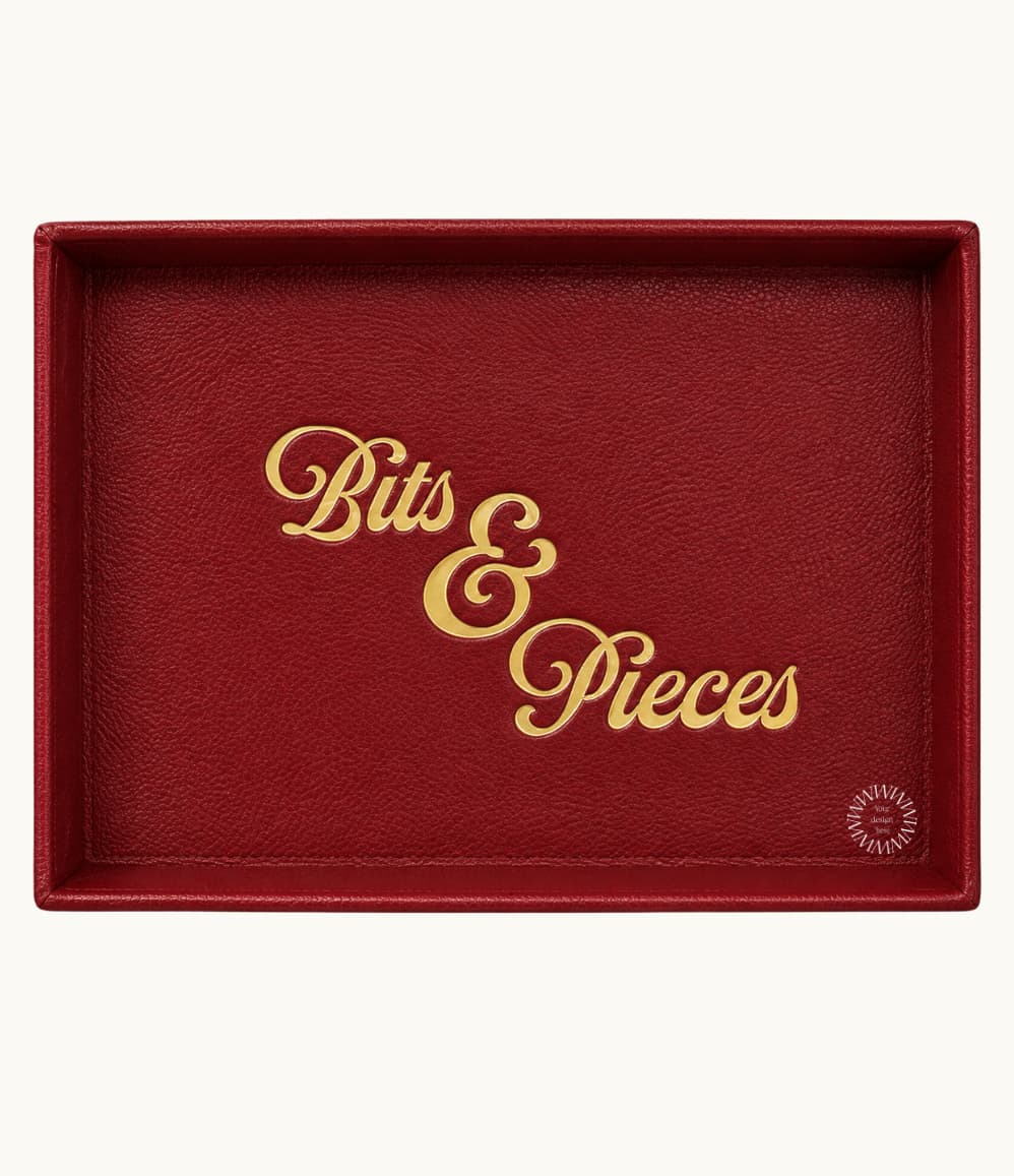 Red desk tray personalised with gold Bits and Pieces lettering showing logo placement