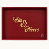 Red desk tray personalised with gold Bits and Pieces lettering showing logo placement