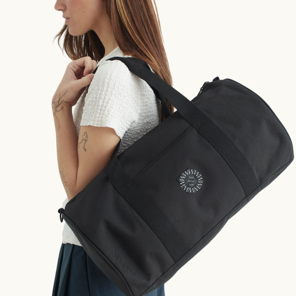 Lifestyle photo of black recycled PET multipurpose water resistant duffle bag eco friendly best corporate swag