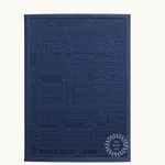 Blue notebook with embossed design of the city of Madrid. Personalised corporate gift from women-owned brands