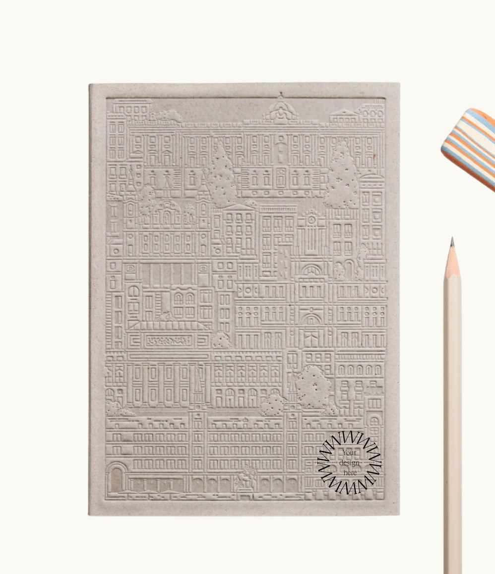 Grey notebook with embossed design of the city of Madrid. Personalised corporate gift from women-owned brands