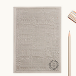 Grey notebook with embossed design of the city of Madrid. Personalised corporate gift from women-owned brands