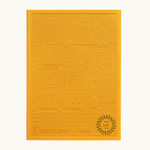 Yellow notebook with embossed design of the city of Madrid. Personalised corporate gift from women-owned brands