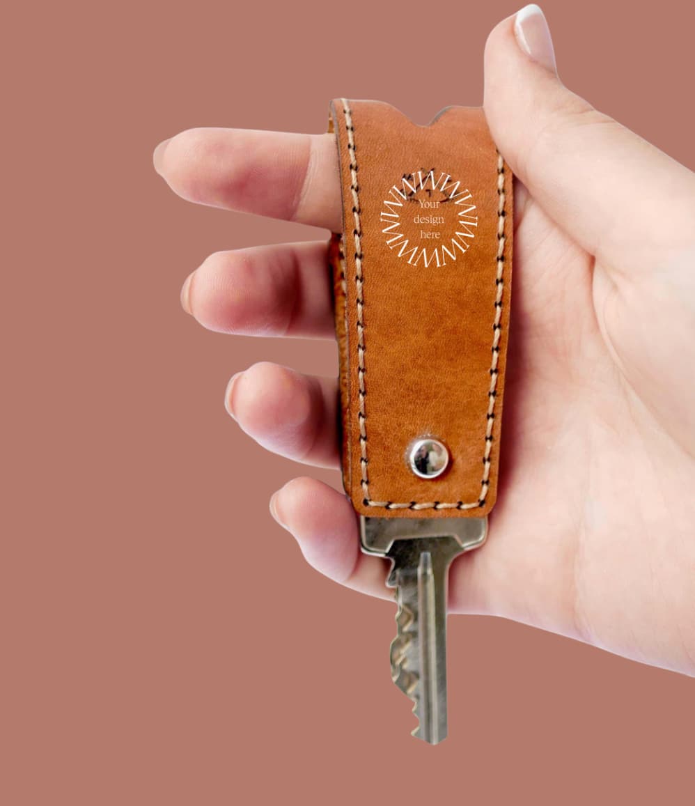 Hand-stitched cognac leather key holder, a custom branded executive gift with your logo. Sustainably made.
