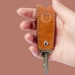Hand-stitched cognac leather key holder, a custom branded executive gift with your logo. Sustainably made.