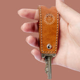 Hand-stitched cognac leather key holder, a custom branded executive gift with your logo. Sustainably made.