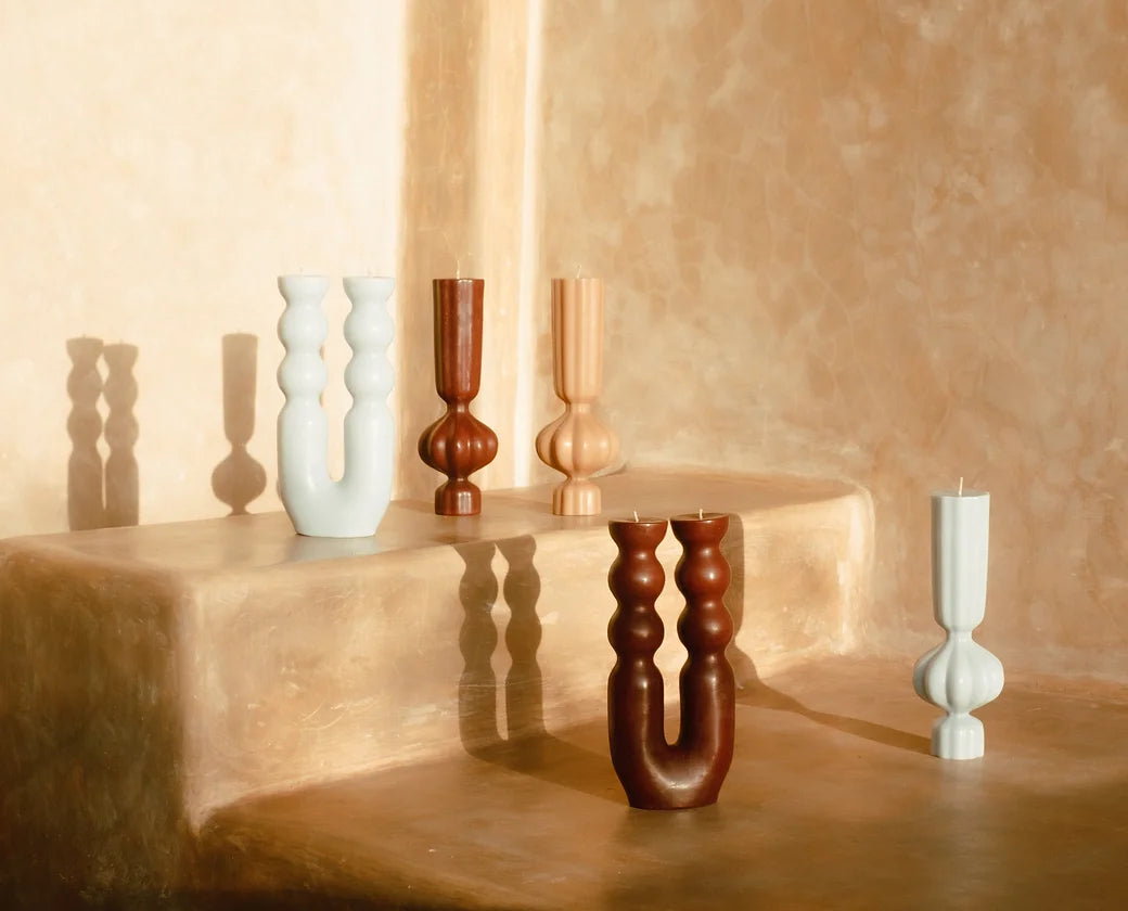 Sculptural pillar candle used as table décor for corporate events