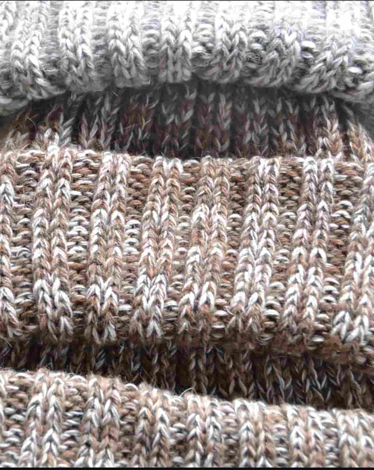 Close up of hand knitted merino wool Fisherman beanies