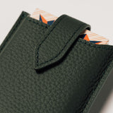 Detail of green leather travel playing cards set, a premium executive gift handcrafted from full grain leather.