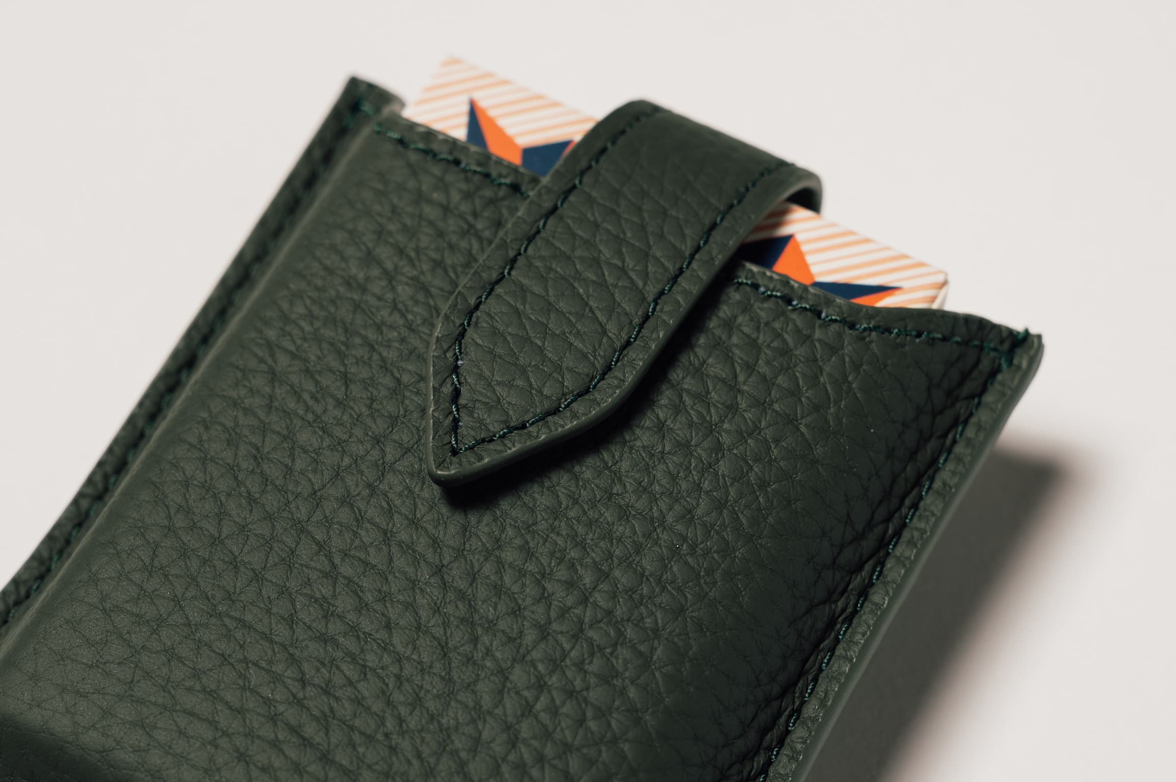 Detail of green leather travel playing cards set, a premium executive gift handcrafted from full grain leather.