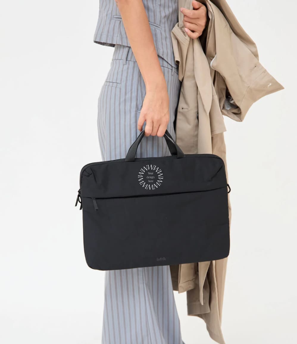 Black recycled laptop briefcase personalised with company logo being carried by hand