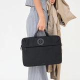 Black recycled laptop briefcase personalised with company logo being carried by hand