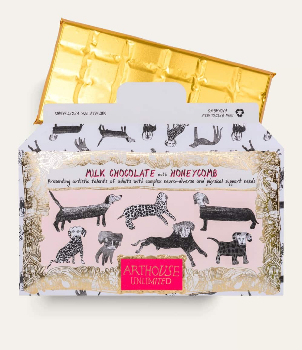 Open milk chocolate honeycomb bar and its wrapper