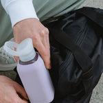 NUOC eco glass bottle with lavender silicone sleeve, 500ml premium swag for conference giveaways and sustainable corporate goodies