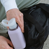 NUOC eco glass bottle with lavender silicone sleeve, 500ml premium swag for conference giveaways and sustainable corporate goodies