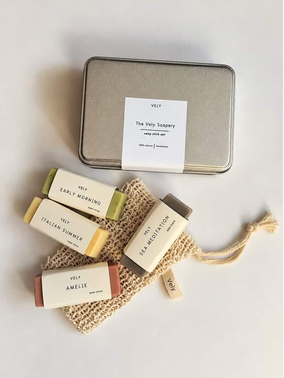 Four natural mini soaps with sisal soap bag and gift tin