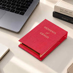 Red Moments of Genius refillable notepad on a contemporary office desk with laptop and pen