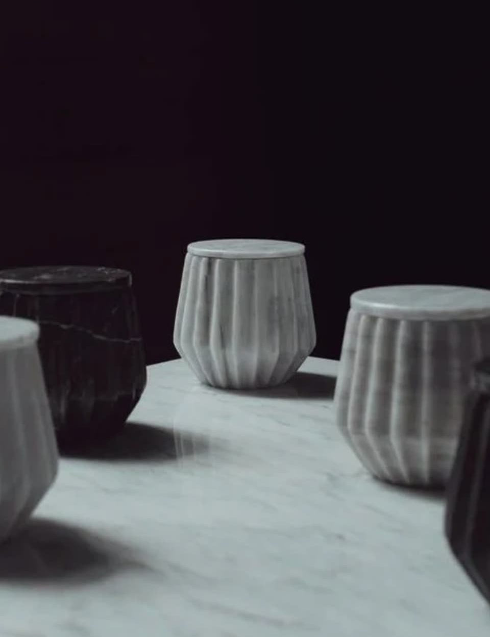 Hand-carved marble jars in grey and black, sustainable gifts for corporate women