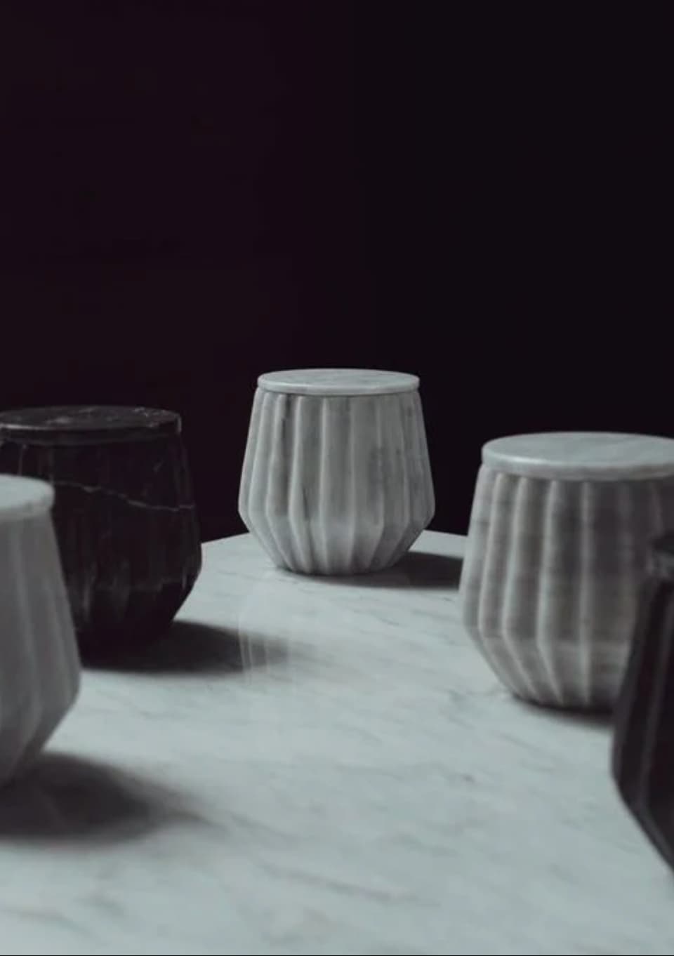 Hand-carved marble jars in grey and black, sustainable gifts for corporate women