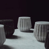 Hand-carved marble jars in grey and black, sustainable gifts for corporate women