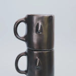 Artisan Clay Coffee Mug in black, stacked