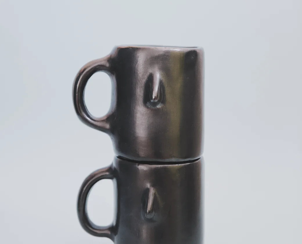 Artisan Clay Coffee Mug in black, stacked