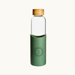 Bamboo Lid Glass Water Bottle in forest green, showing logo placement