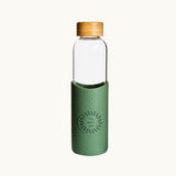 Bamboo Lid Glass Water Bottle in forest green, showing logo placement