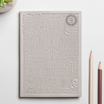 Debossed Barcelona notebook in grey. Branded sustainable notebook from women-owned brands.