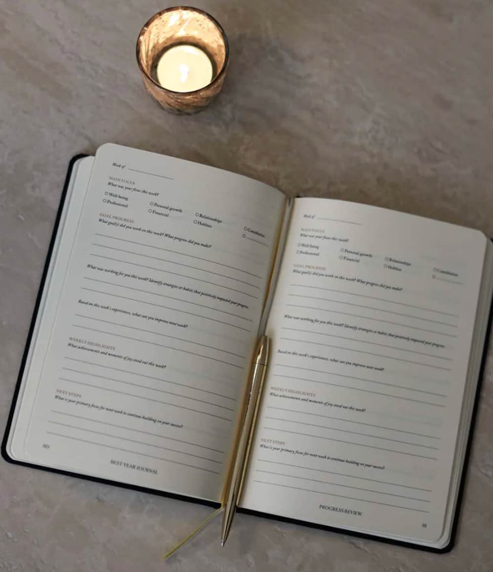 Best Year Journal, open and styled, showing pages with prompts