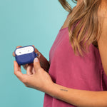 Blue leather AirPods case with logo branding for conferences, brand activations and client gifting.