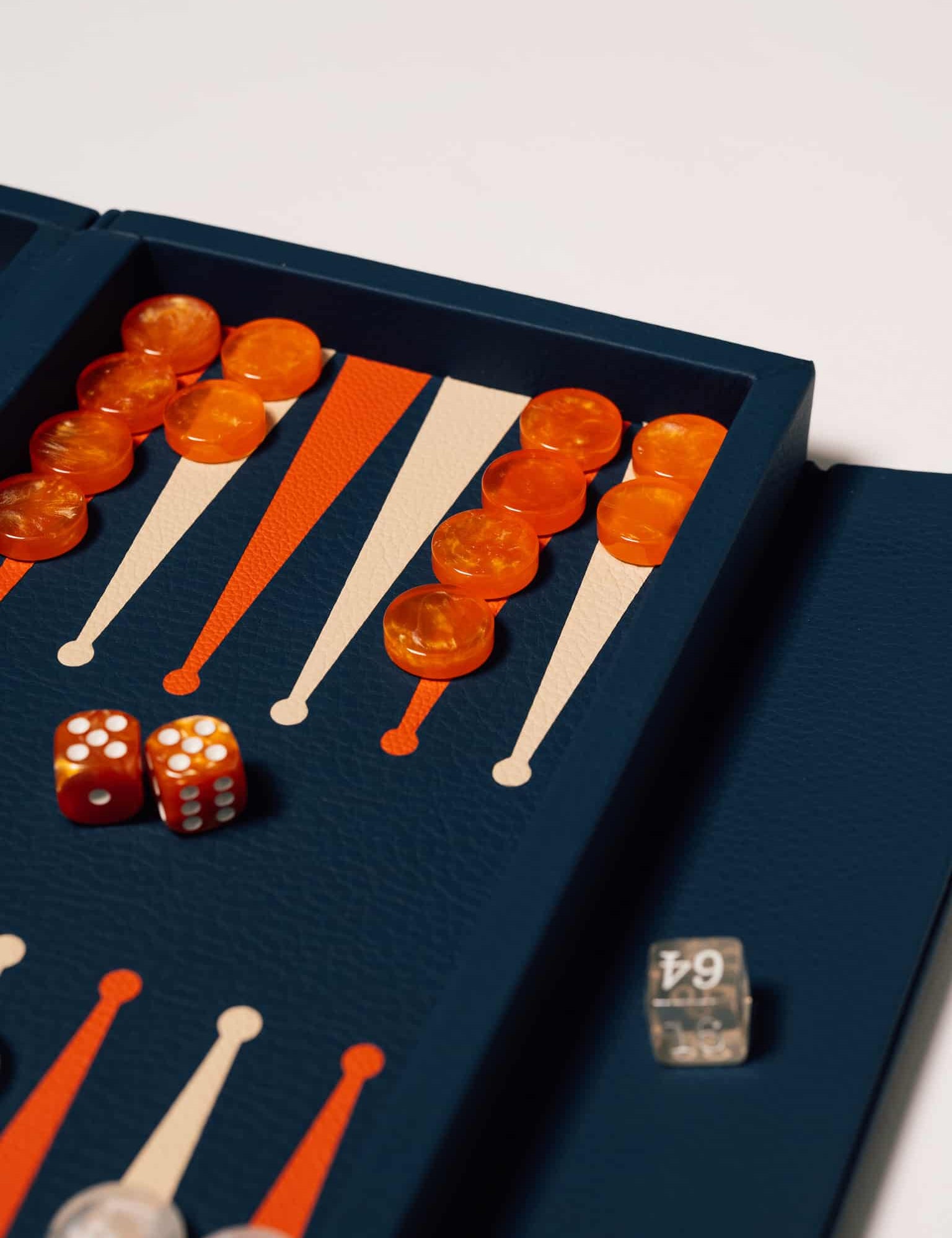 Blue booklet leather backgammon set with magnetic closure, a personalised corporate gift from women-owned brands.