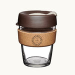 12oz reusable glass cup with a natural cork band, mocha lid, showing logo placement on the cork band