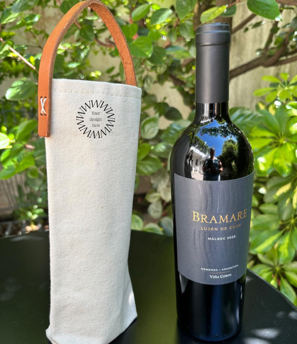 Reusable canvas wine bottle bag with tan handles for corporate gifts