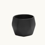 Detail of ceramic coffee cup in black handcrafted stoneware, dishwasher and microwave safe. Sustainable employee appreciation gift.