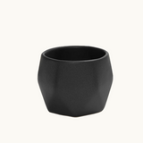 Detail of ceramic coffee cup in black handcrafted stoneware, dishwasher and microwave safe. Sustainable employee appreciation gift.