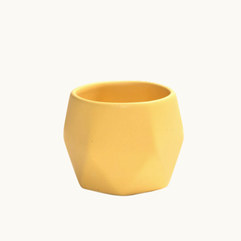 Detail of ceramic coffee cup in yellow. handcrafted stoneware, dishwasher and microwave safe. Sustainable employee appreciation gift.